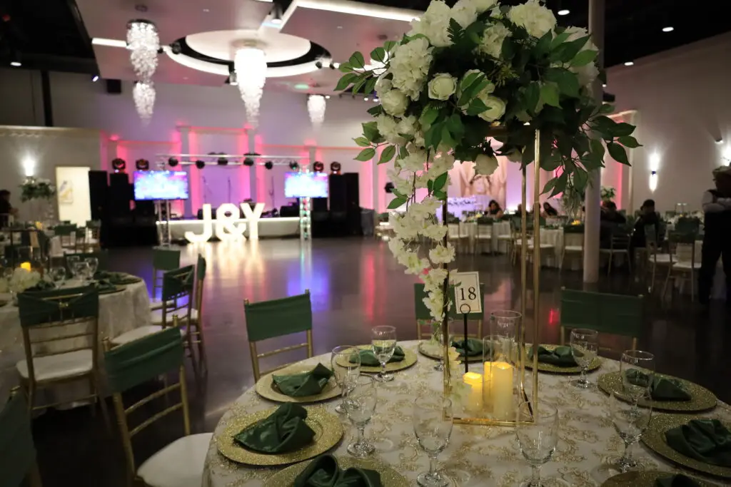 Wedding Reception, Wedding Venue, Full Bar, Amenities, Bride & Groom, Green and Gold color scheme, Tall centerpieces, white and cream flowers, Event Venue, Perfect Venue, Quince Venue, Quince Salon, Wedding Venue, Party Venue, Banquet Hall, Banquet Hall Rental, Event Center, Event Space, Birthday Event Space, Large guest count event space, spacious event hall, Luxurious Event Space, Elegant Event Hall, Elegant Banquet Hall Fairy Tale Event Space, Majestic Ballroom