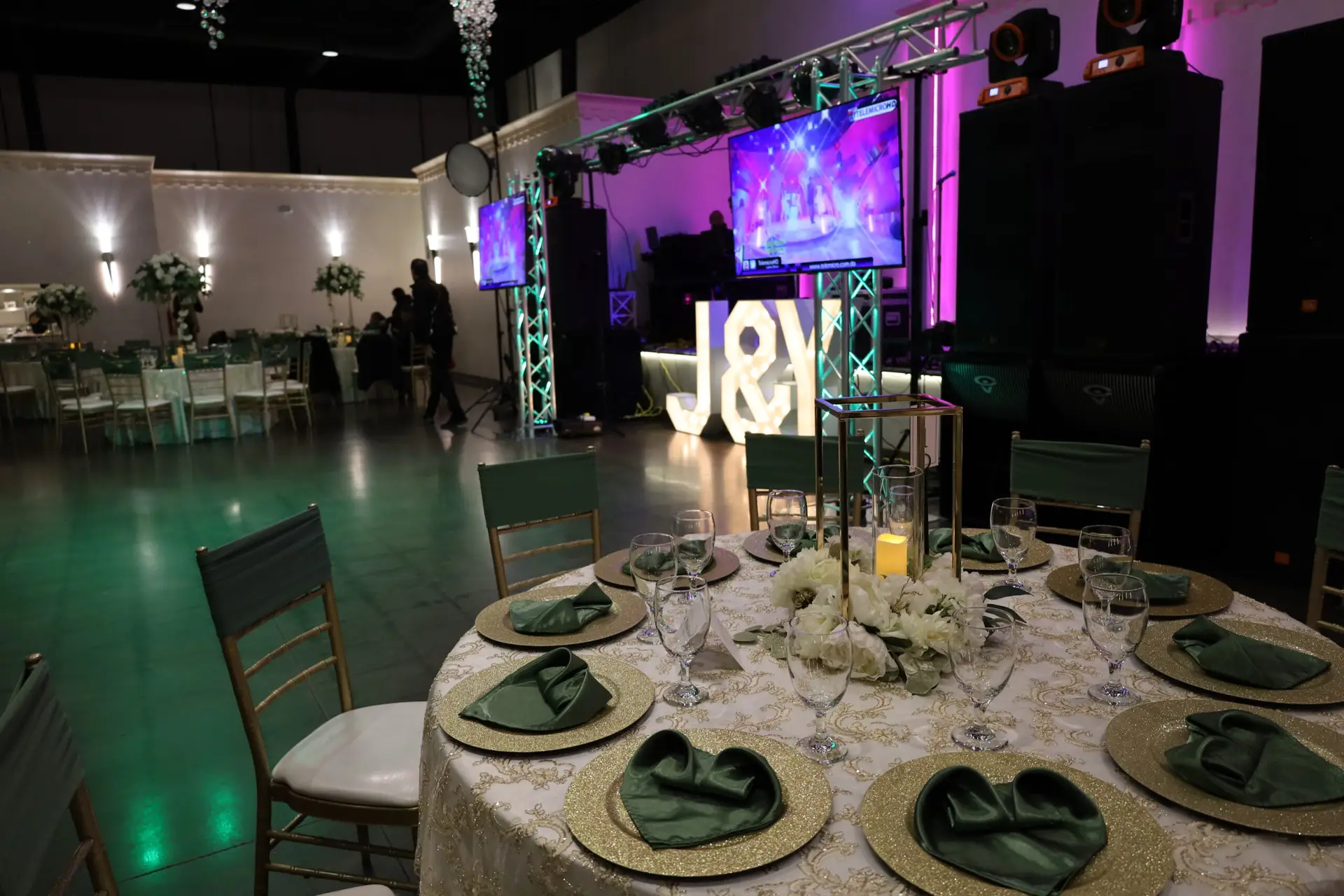Elegant entertainment stage positioned front and center in a luxurious ballroom, featuring state-of-the-art lighting and sound for captivating performances at any event.