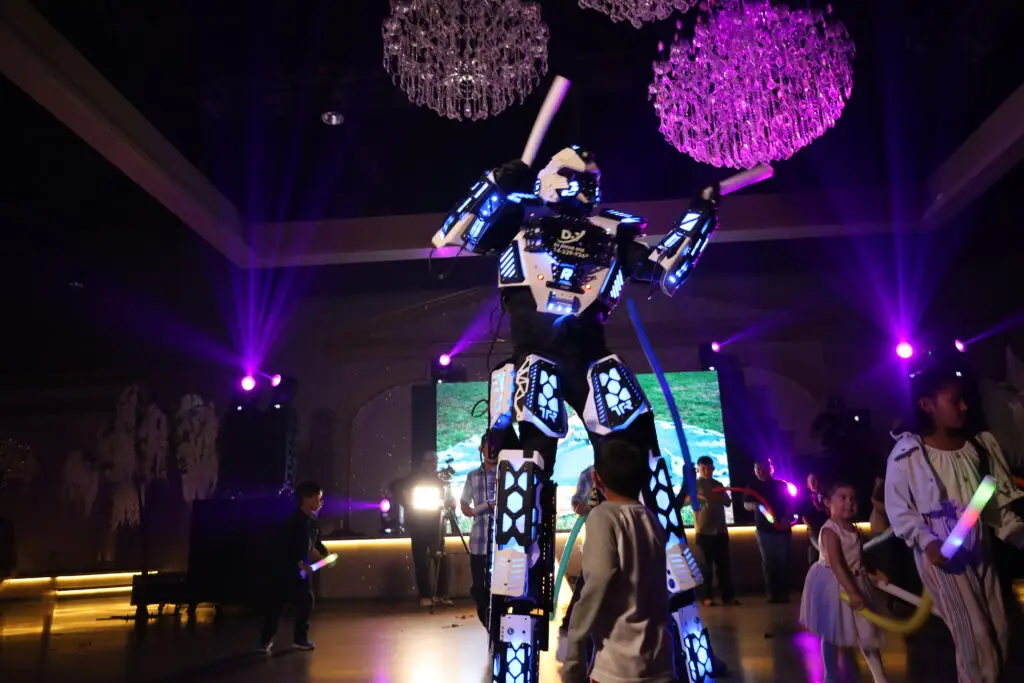 Elegant entertainment stage positioned front and center in a luxurious ballroom, featuring state-of-the-art lighting and sound for captivating performances at any event.