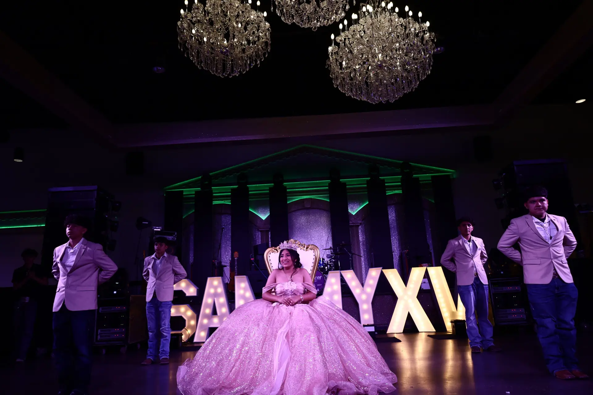 Elegant entertainment stage positioned front and center in a luxurious ballroom, featuring state-of-the-art lighting and sound for captivating performances at any event.